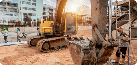 Construction equipment yard with excavators and scaffolding