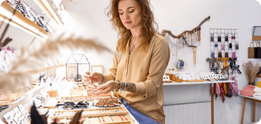 Multi-vendor marketplace showing handcrafted products from independent makers with commission tracking