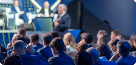 Tech conference check-in showing digital wallet passes and QR code scanning with real-time attendance tracking